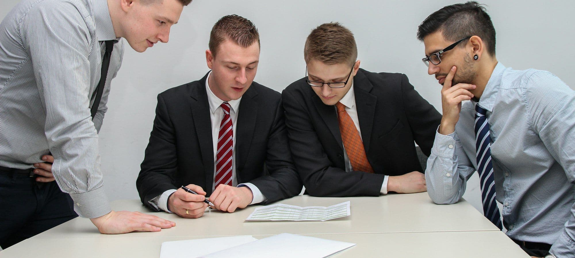 A team reviewing documents together at a conference table